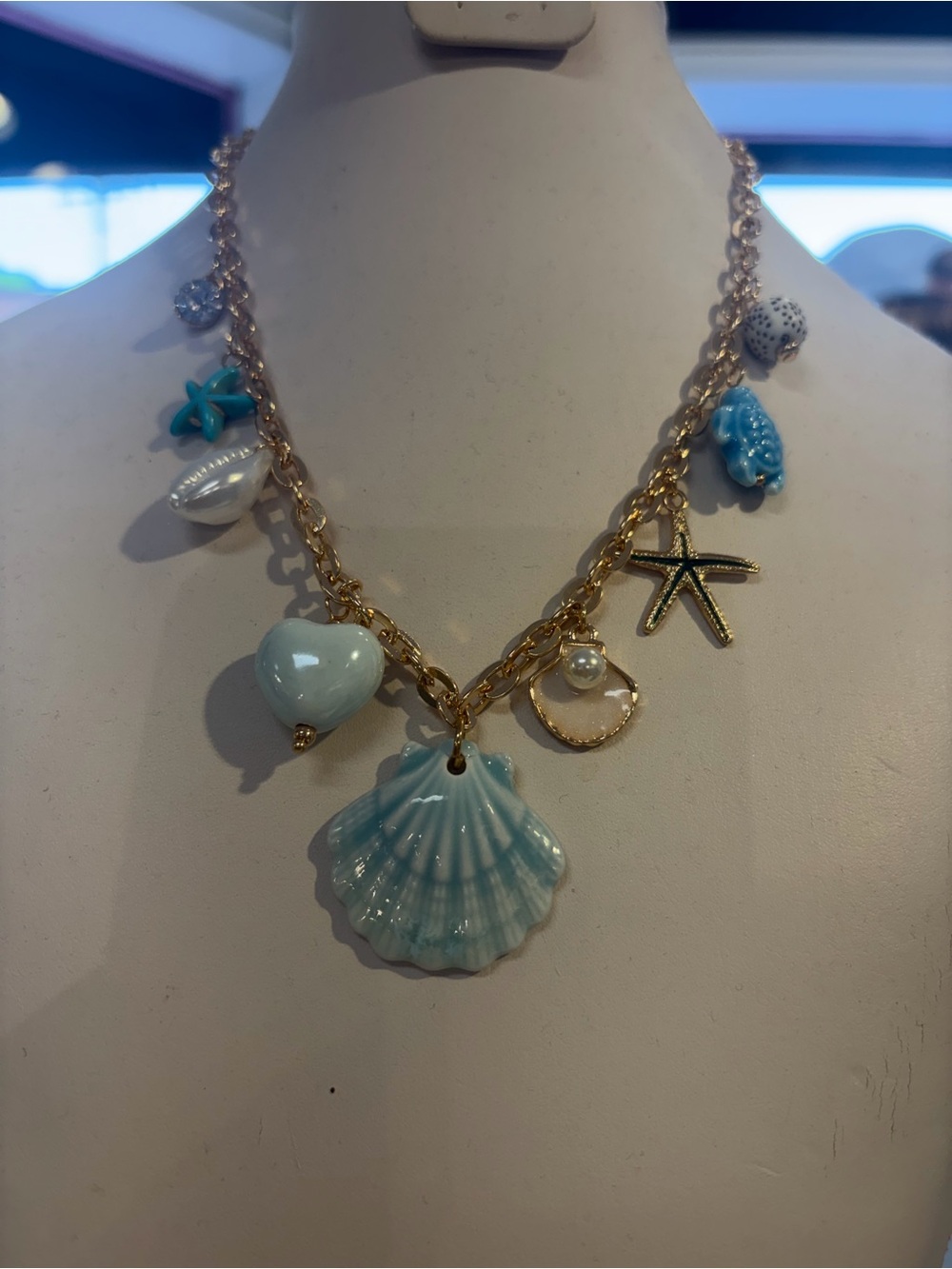 Sea Breeze Gold Charm Necklace with Light Blue Shell